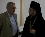 Fr. Nektariy talks with<br>Russian Embassador Valry Morozov.
