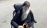 Fr Job in his new mobile chair. 